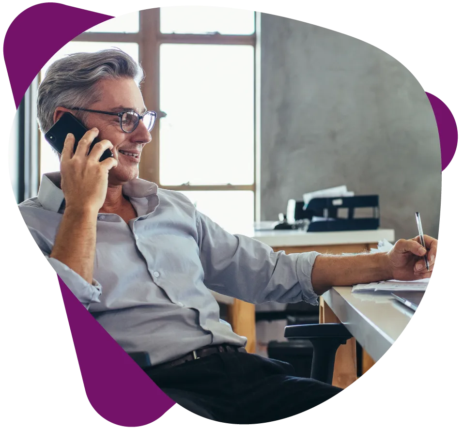 Businessman-in-office-talking-on-phone SQUIBIT UC