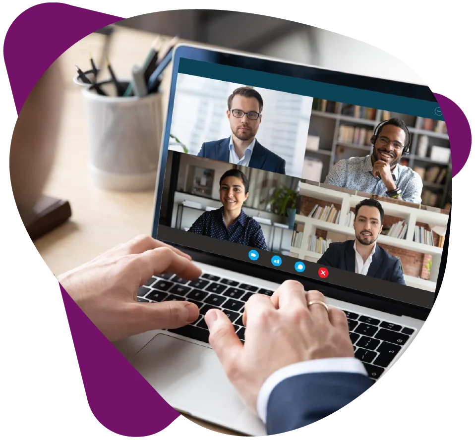 View-over-businessman-shoulder-at-laptop-where-four-multiracial-colleagues-engaged-at-group-meeting-on-line Web Conference Manager